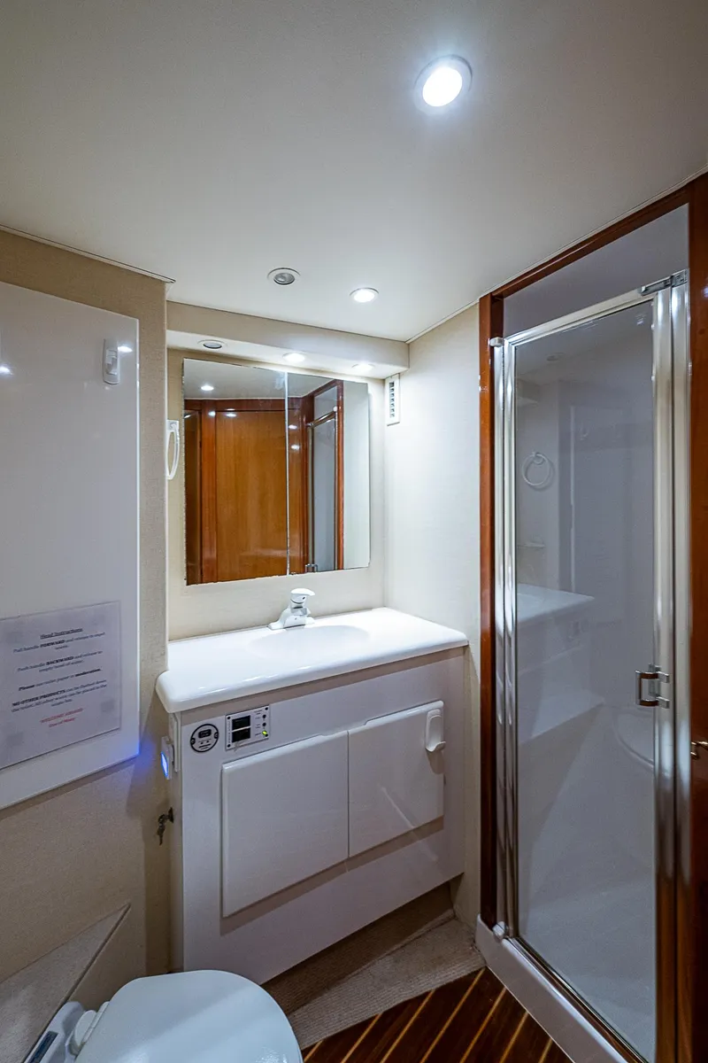 Slide: The Image of Luxurious bathroom in 1999 Post 50 Convertible yacht with modern fixtures and shower. - 42
