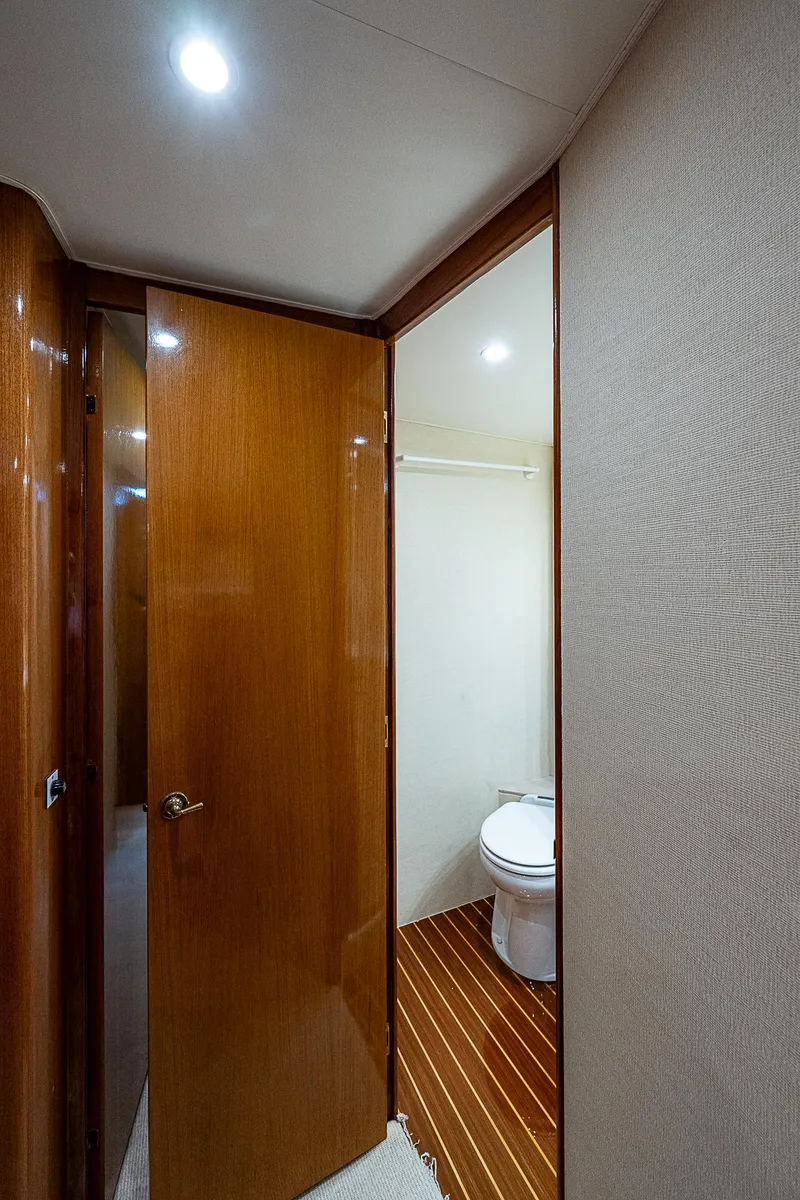 Slide: The Image of 1999 Post 50 Convertible yacht bathroom with wooden door and flooring. - 47