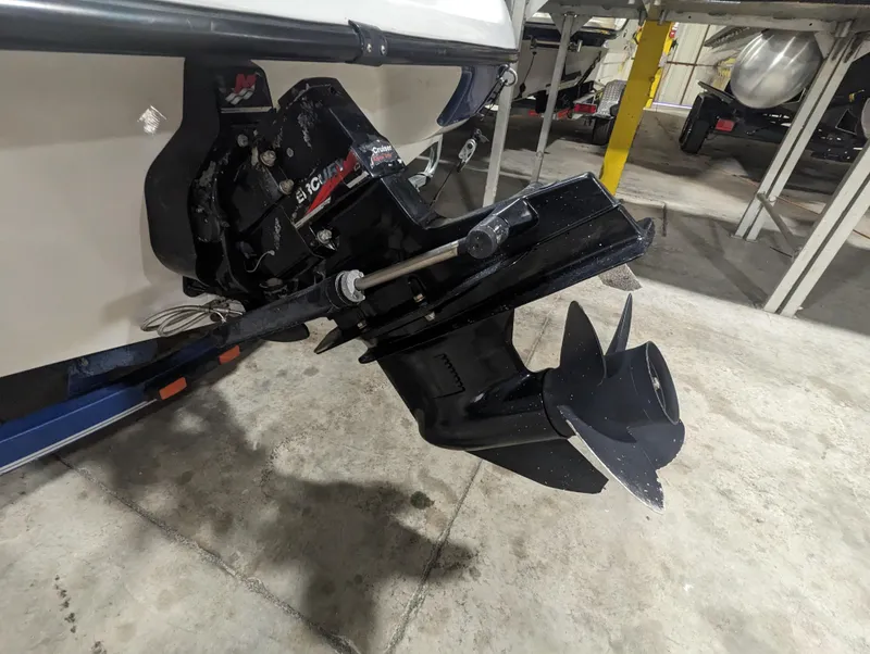 Slide: The Image of 2003 Crownline 180 BR boat with a MerCruiser outdrive in a storage facility. - 3