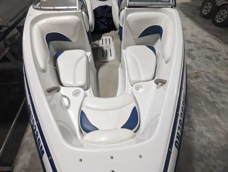 Slide: The Image of 2003 Crownline 180 BR boat interior with white and blue seating. - 5
