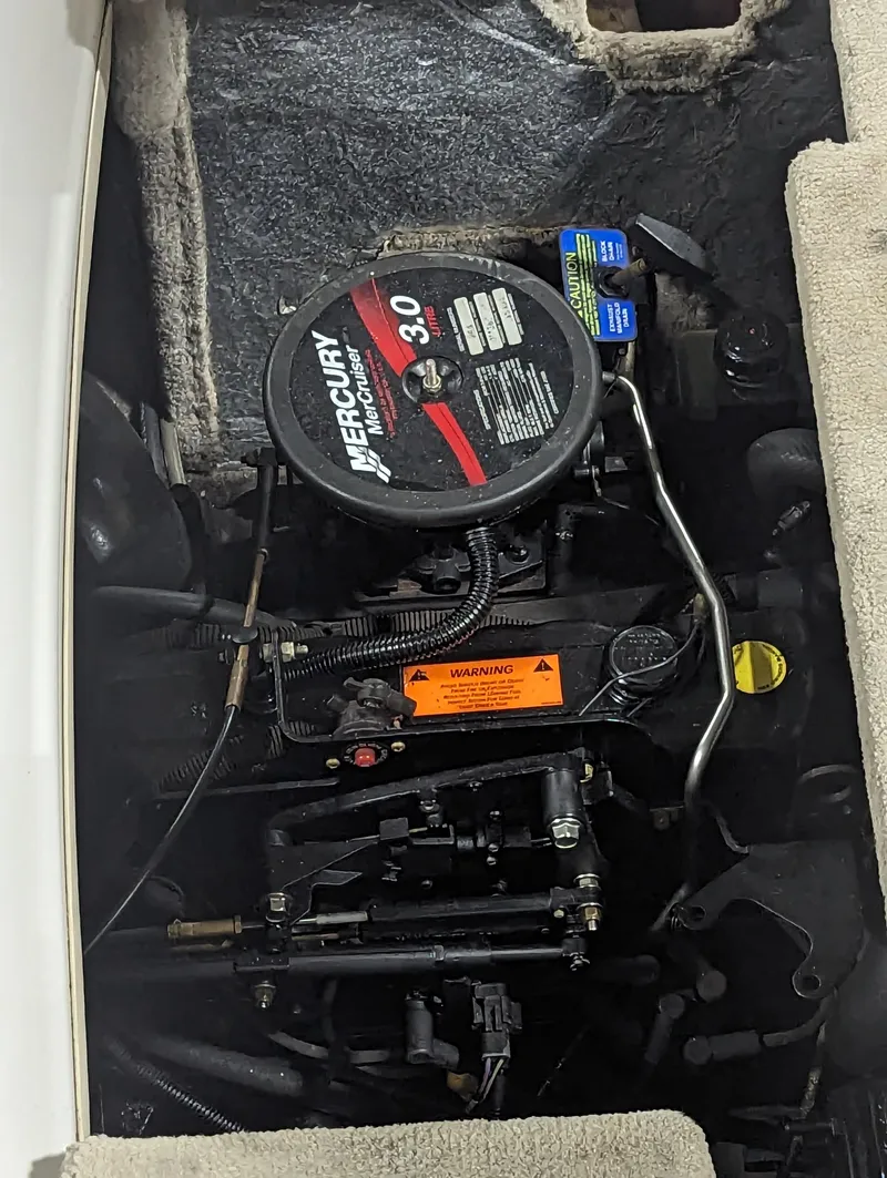 Slide: The Image of 2003 Crownline 180 BR boat engine, featuring a Mercury 3.0 motor. - 8