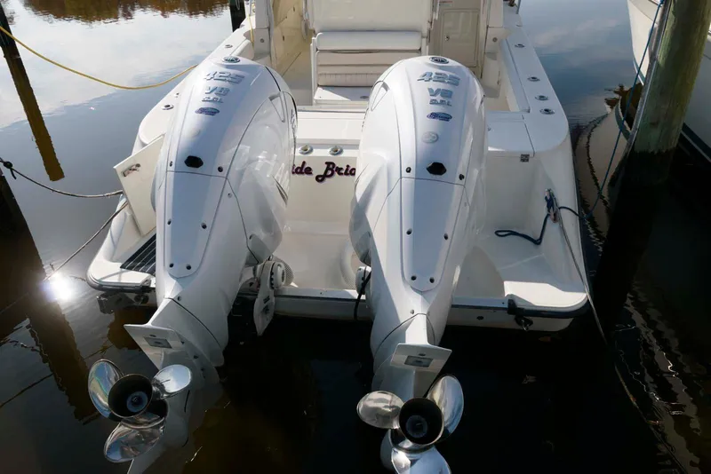 Slide: The Image of 2008 Hydra-Sports Vector 3500 VX boat with dual outboard engines docked. - 2
