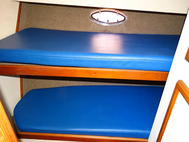 Slide: The Image of Interior of 1991 Egg Harbor 33 Sedan with blue bunks. - 16