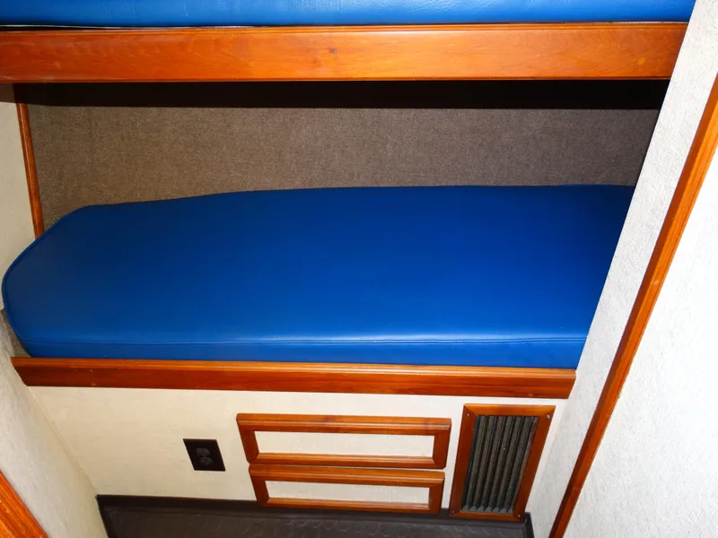 Slide: The Image of Interior of 1991 Egg Harbor 33 Sedan with blue mattress. - 17