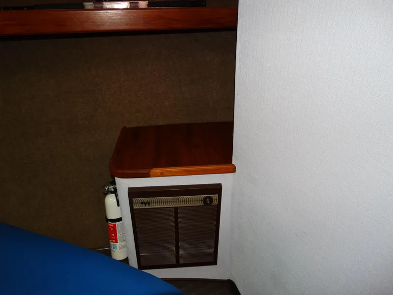 Slide: The Image of Interior of 1991 Egg Harbor 33 Sedan with wooden table and fire extinguisher. - 18