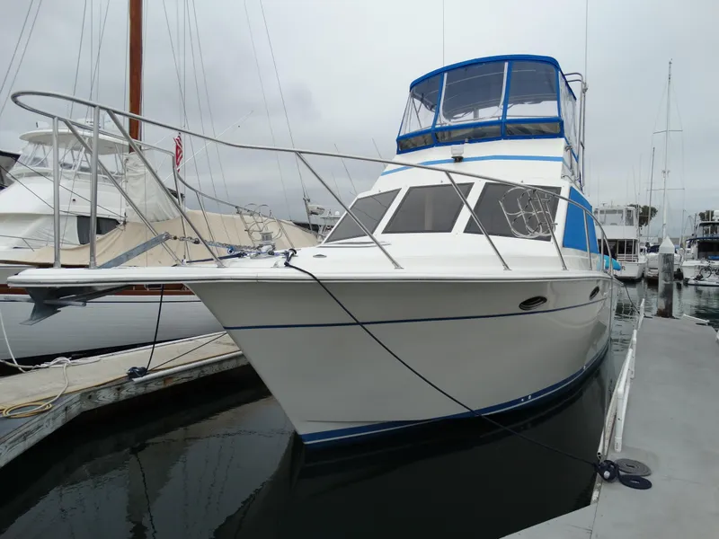Slide: The Image of 1991 Egg Harbor 33 Sedan yacht docked in harbor. - 2