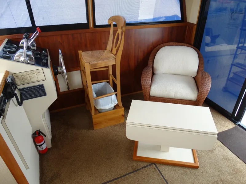 Slide: The Image of Interior of a 1991 Egg Harbor 33 Sedan with helm and seating area. - 26