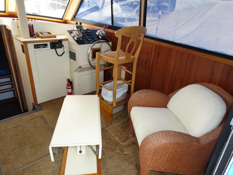 Slide: The Image of Interior of a 1991 Egg Harbor 33 Sedan yacht with seating area. - 27