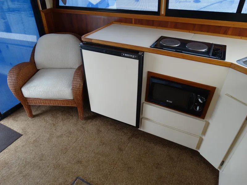 Slide: The Image of Interior of 1991 Egg Harbor 33 Sedan with kitchenette and seating area. - 28