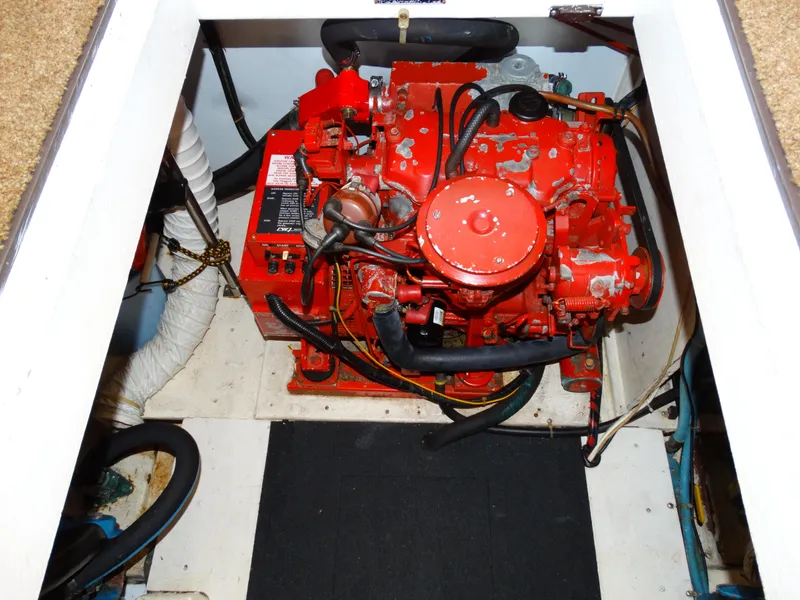 Slide: The Image of Engine room of a 1991 Egg Harbor 33 Sedan with red engine. - 31