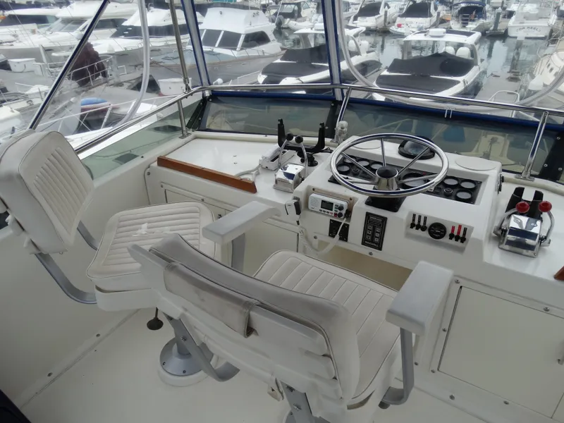Slide: The Image of 1991 Egg Harbor 33 Sedan cockpit with steering and instruments. - 35