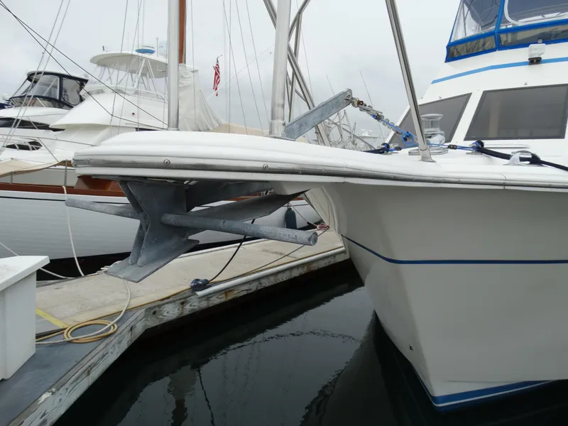 Slide: The Image of 1991 Egg Harbor 33 Sedan at dock with anchor. - 42