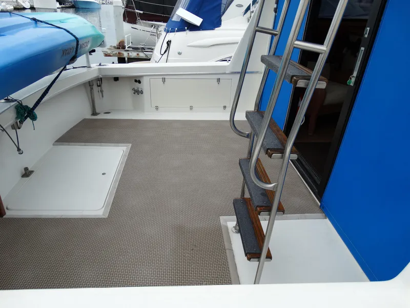 Slide: The Image of Deck of a 1991 Egg Harbor 33 Sedan boat with blue trim. - 7