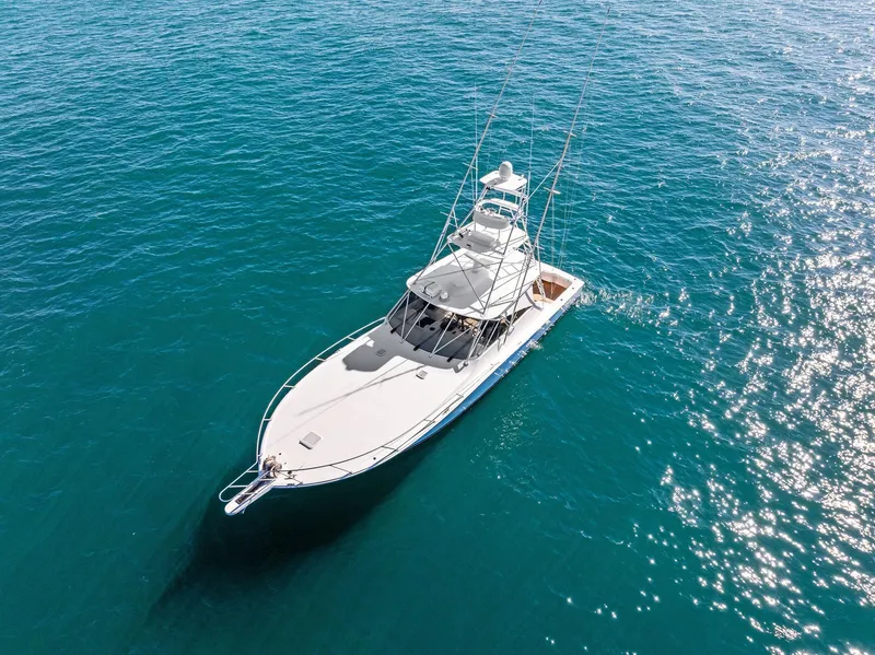 Slide: The Image of 2007 Viking 52 Open yacht cruising on clear blue water. - 13