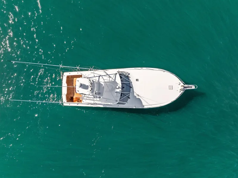 Slide: The Image of Aerial view of 2007 Viking 52 Open yacht on turquoise water. - 14
