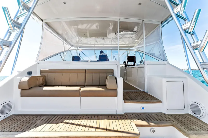 Slide: The Image of 2007 Viking 52 Open yacht interior with seating and helm, showcasing luxury marine design. - 26