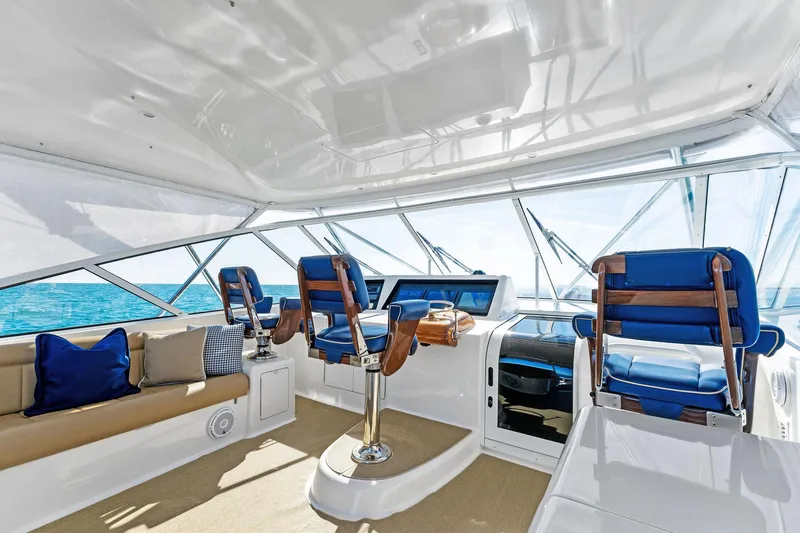 Slide: The Image of Luxurious interior of 2007 Viking 52 Open yacht with plush seating and ocean view. - 28
