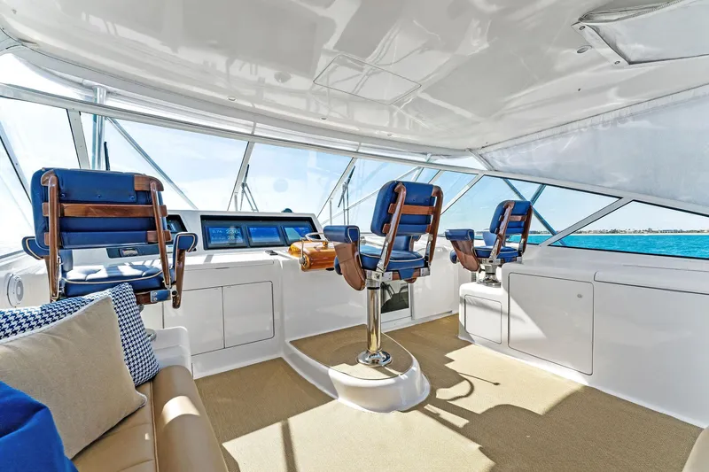 Slide: The Image of Interior of 2007 Viking 52 Open yacht with helm chairs and panoramic windows. - 30