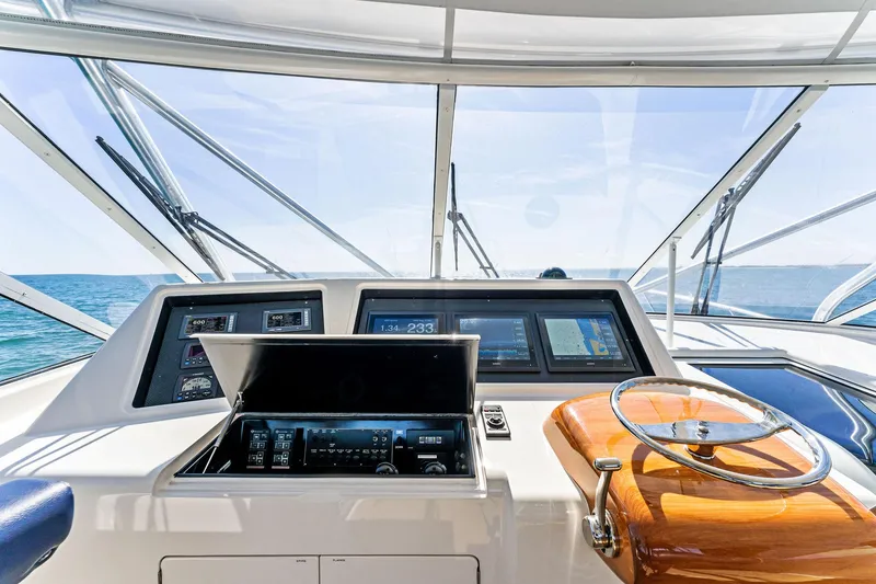 Slide: The Image of 2007 Viking 52 Open yacht helm with modern navigation equipment and ocean view. - 31