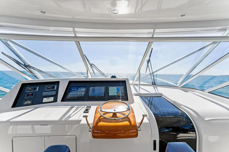 Slide: The Image of 2007 Viking 52 Open yacht helm with ocean view and navigation instruments. - 32