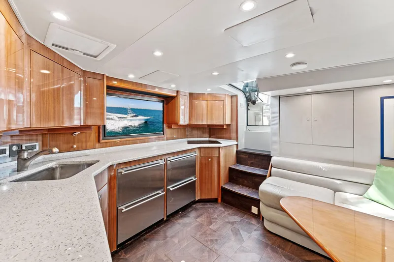 Slide: The Image of Luxurious interior of a 2007 Viking 52 Open yacht with modern kitchen and seating area. - 41