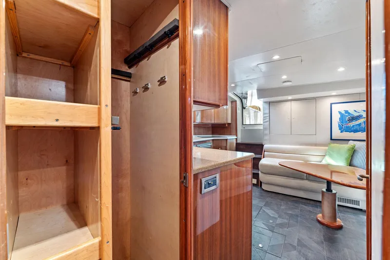 Slide: The Image of Interior of 2007 Viking 52 Open yacht with wood cabinetry and cozy seating area. - 45