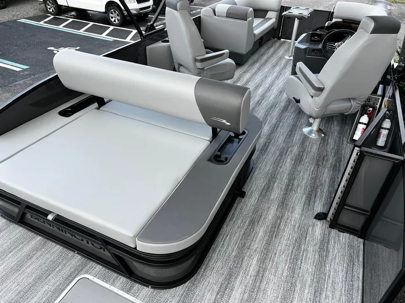 Slide: The Image of 2025 Bennington S 22 pontoon boat interior with gray seating and modern design. - 14