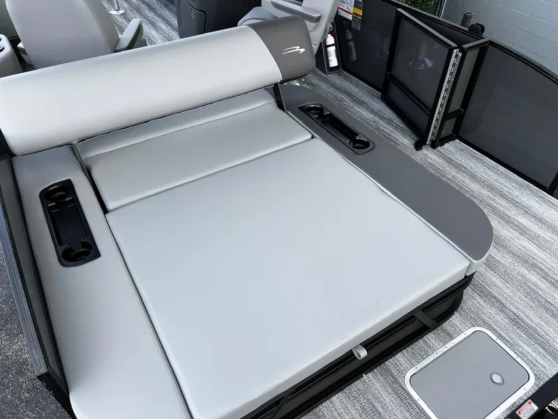 Slide: The Image of 2025 Bennington S 22 boat interior with gray seating and cup holders. - 15