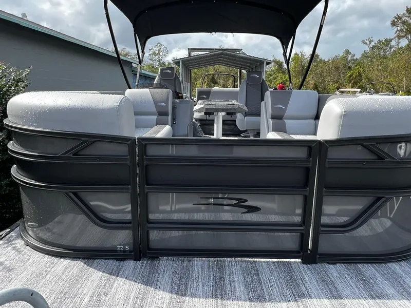 Slide: The Image of 2025 Bennington S 22 pontoon boat with sleek seating and canopy. - 5