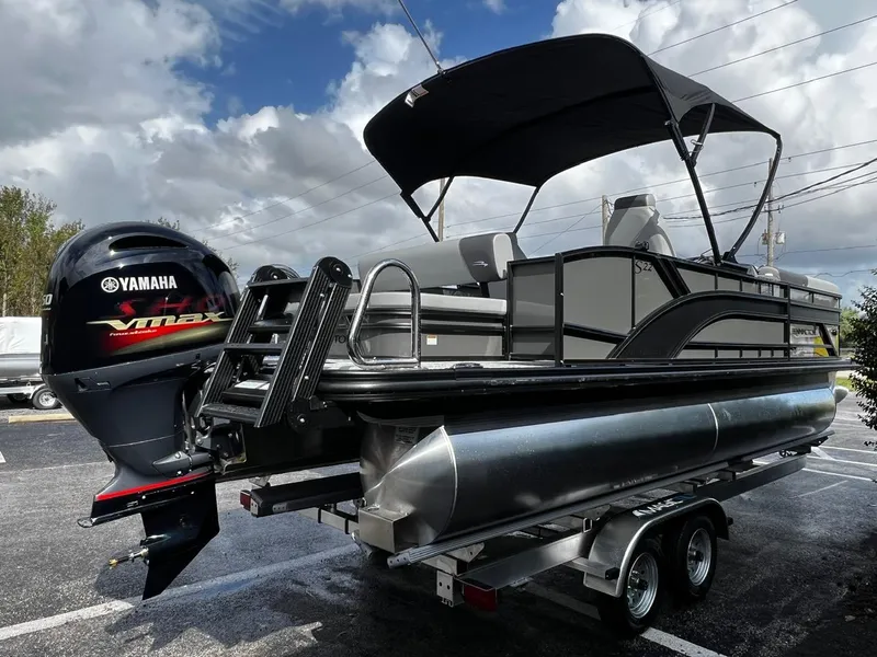 Slide: The Image of 2025 Bennington S 22 pontoon boat with Yamaha engine on trailer. - 7