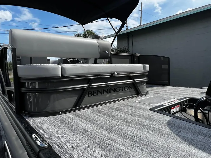 Slide: The Image of 2025 Bennington S 22 pontoon boat with sleek design and comfortable seating. - 9