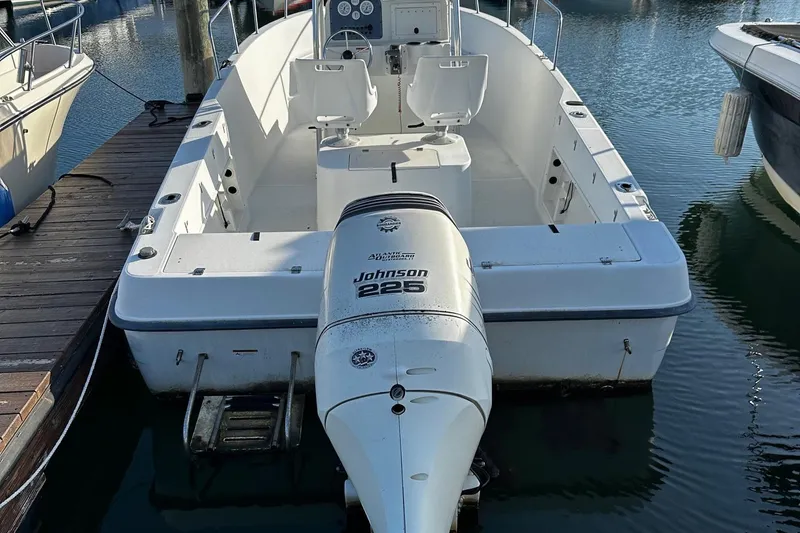 Slide: The Image of 2005 Hydra-Sports 2300 CC boat with Johnson 225 engine docked at marina. - 3