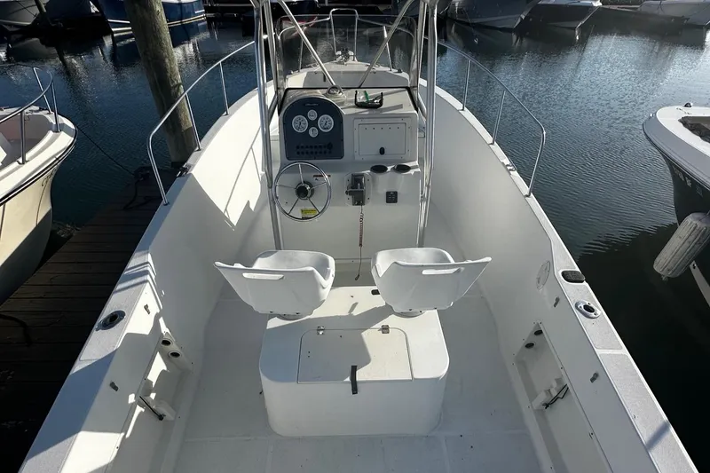 Slide: The Image of 2005 Hydra-Sports 2300 CC boat interior with dual seats and steering console. - 4