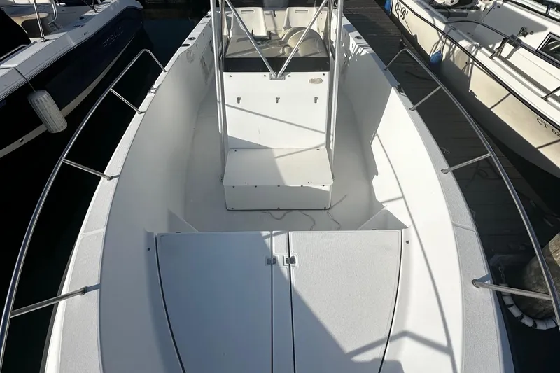 Slide: The Image of 2005 Hydra-Sports 2300 CC boat interior, featuring spacious deck and seating area. - 6