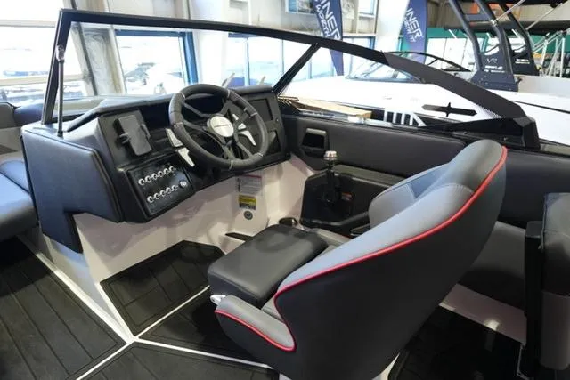 Slide: The Image of 2025 Moomba Mojo boat interior with modern dashboard and steering wheel. - 10