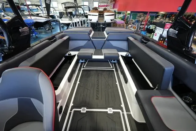Slide: The Image of 2025 Moomba Mojo boat interior with spacious seating and modern design. - 15