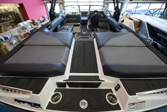 Slide: The Image of 2025 Moomba Mojo boat interior with spacious seating and modern design. - 16