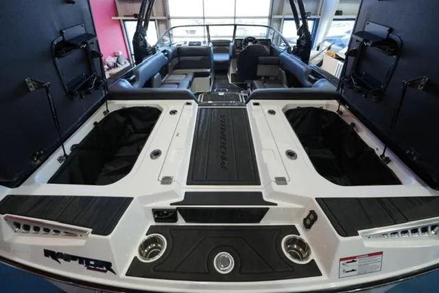 Slide: The Image of 2025 Moomba Mojo boat interior with spacious seating and modern design features. - 18