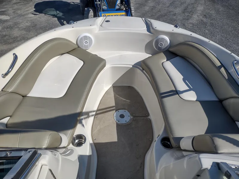 Slide: The Image of 2006 Sea Ray 200 Sundeck boat interior with cushioned seating and speakers. - 7