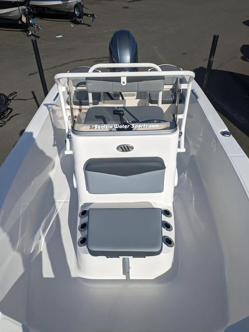 Slide: The Image of 2025 Robalo R160 boat interior with seating and console, viewed from above. - 12