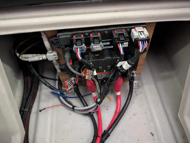Slide: The Image of Electrical wiring panel in a 2019 Manitou 25 Encore SE boat. - 28
