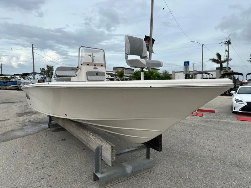 Slide: The Image of 2025 Sea Chaser 21 LX boat on display in a parking lot. - 11