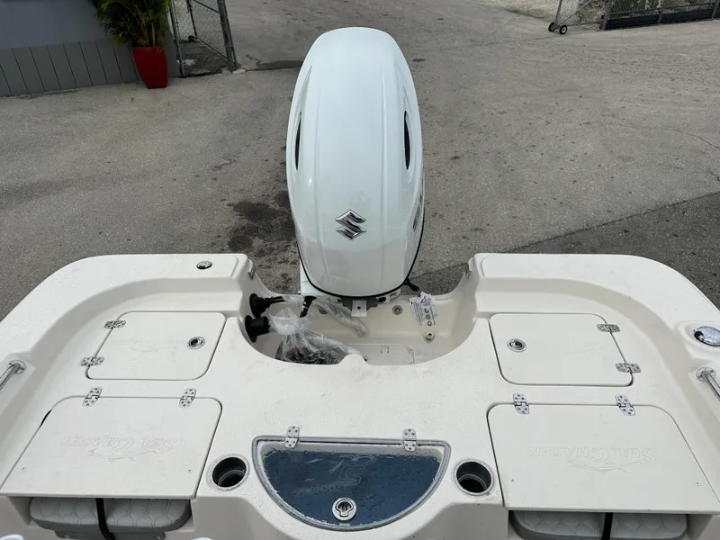 Slide: The Image of 2025 Sea Chaser 21 LX boat with Suzuki outboard motor, rear deck view. - 24