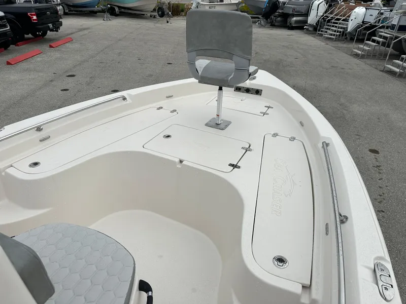 Slide: The Image of 2025 Sea Chaser 21 LX boat interior with seating and storage compartments. - 33