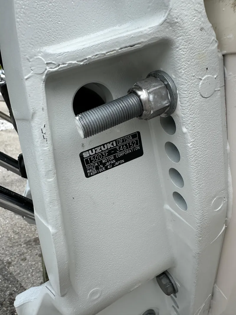 Slide: The Image of Close-up of a 2025 Sea Chaser 21 LX boat engine mount with Suzuki label. - 39