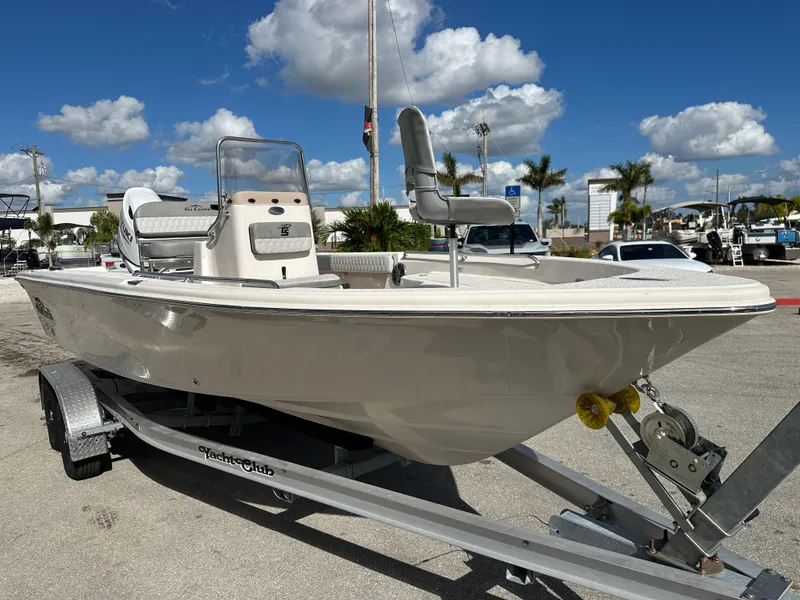 Slide: The Image of 2025 Sea Chaser 21 LX boat on trailer under blue sky. - 4