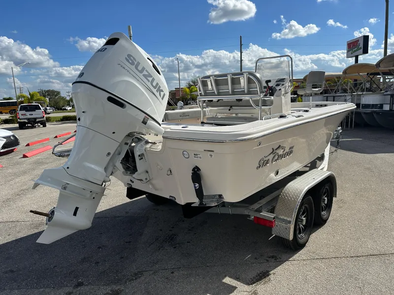 Slide: The Image of 2025 Sea Chaser 21 LX boat with Suzuki outboard motor on trailer. - 6