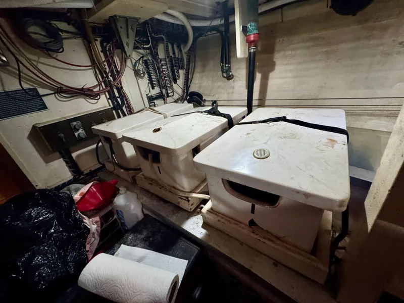 Slide: The Image of Engine room of 1979 Grand Banks Classic boat with equipment and wiring. - 42