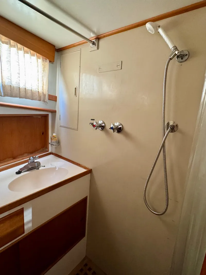 Slide: The Image of 1979 Grand Banks Classic yacht bathroom with shower and sink. - 8