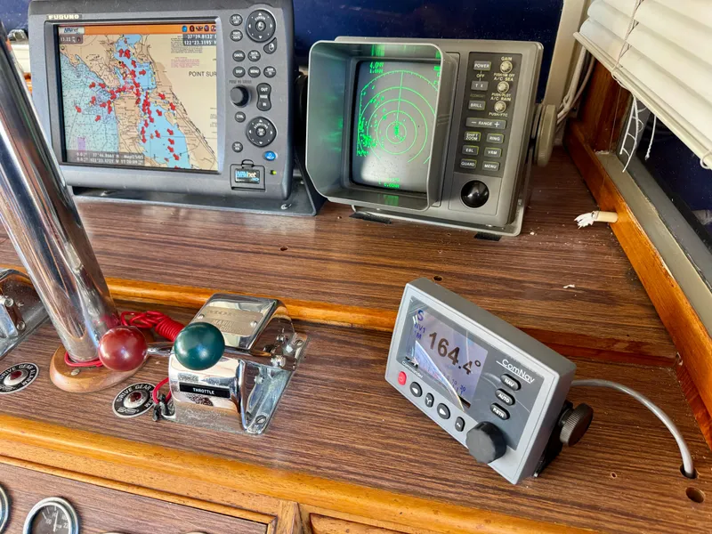 Slide: The Image of 1979 Grand Banks Classic boat dashboard with navigation and radar equipment. - 17